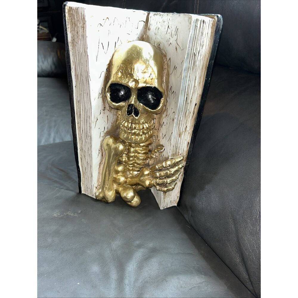 Gold skeleton in a book of spells